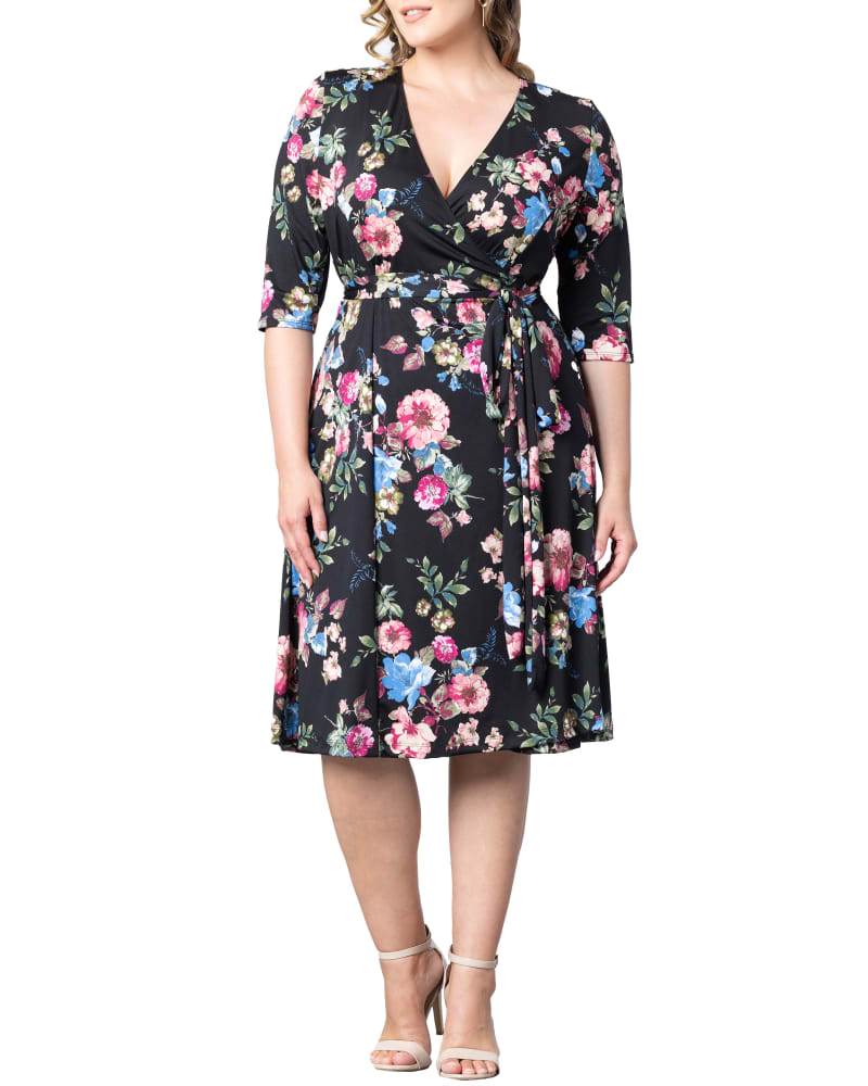 Front of a model wearing a size 1X Essential Wrap Dress in ENCHANTED GARDEN by Kiyonna. | dia_product_style_image_id:312442